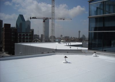 Tall Building with White SPF Roof